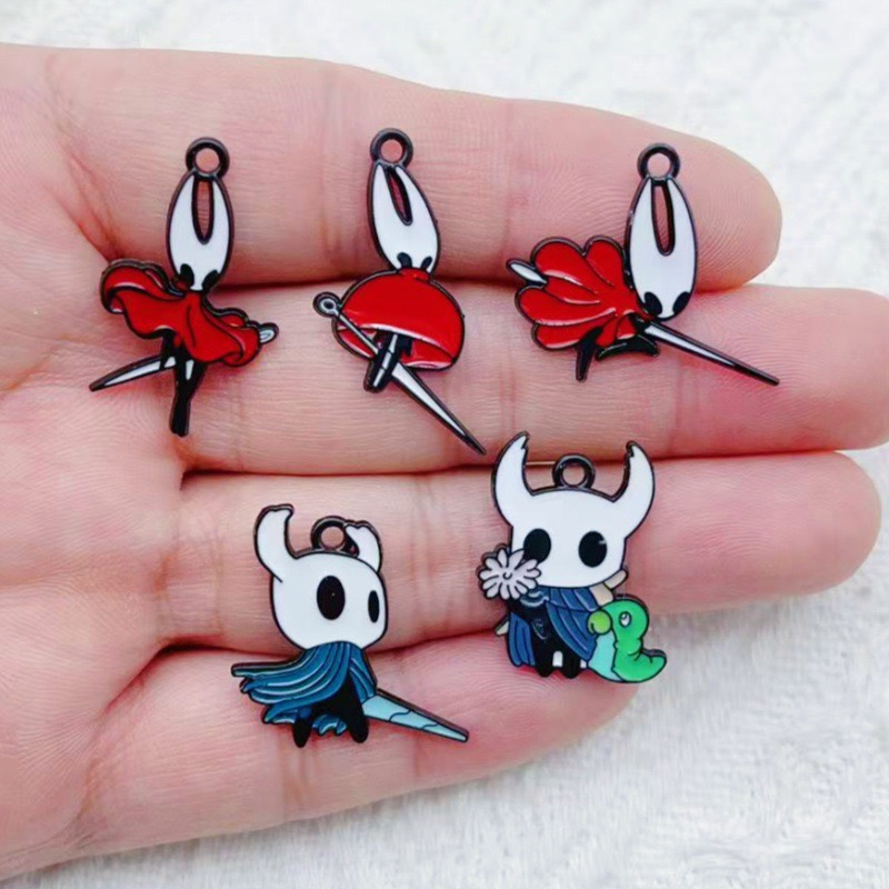 10 pendentifs en alliage motif - Party Games Spy avis et prix